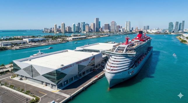 A Virgin Voyages cruise ship docked at the geometric Terminal V facility at the Miami cruise port.